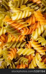 Italian raw pasta - fusilli background closeup
