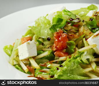 Italian salad with vegetables, mozzarella cheese and apple
