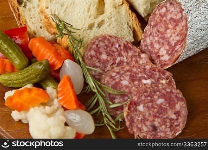 Italian salami with bread,rosemary and pickles