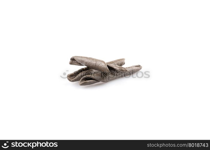 italian seppia pasta fusilli (macaroni) with cuttlefish ink, isolated on white background