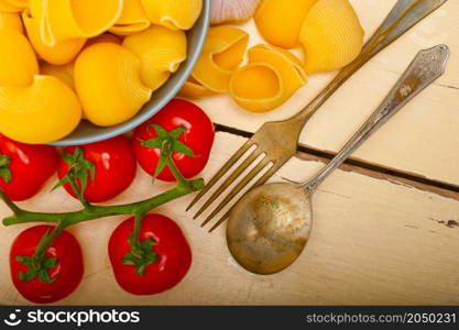 Italian snail lumaconi pasta with ripe cherry tomatoes sauce ingredients