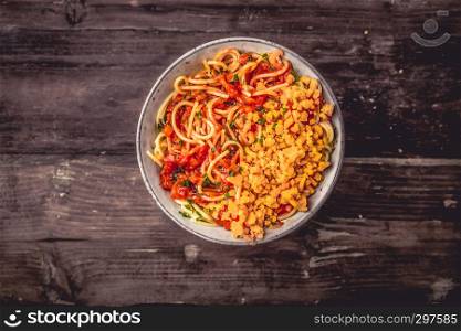 Italian Spaghetti in a bowl with cheddar cheese