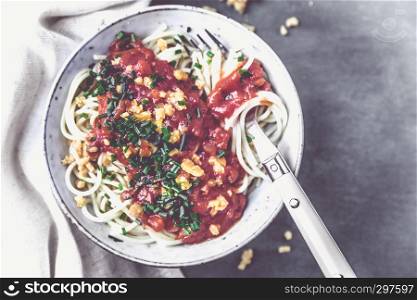 Italian Spaghetti in a bowl with cheddar cheese