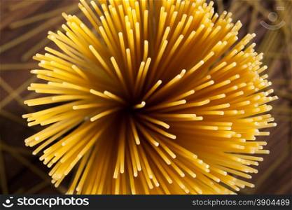 italian spaghetti on wooden background. italian spaghetti on wooden background. Top view