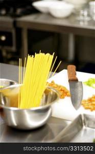 italian spaghetti pasta on a typical full equipped restaurant kitchen