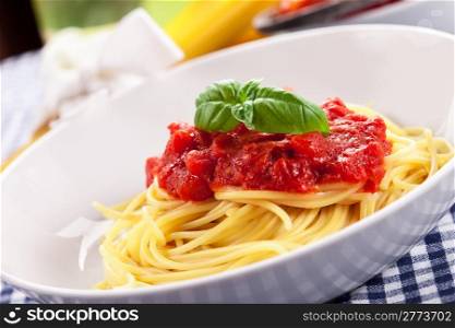 Italian Spaghetti with tomato sauce on traditional home towel