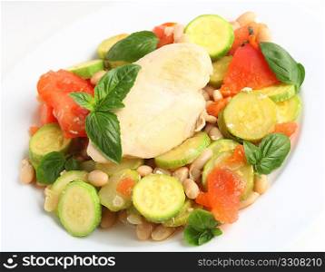 Italian style braised chicken breast on a bed of zucchini and white cannellini beans with tomato and basil.