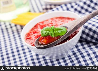 italian tomato sauce on traditional home towel with ingredients