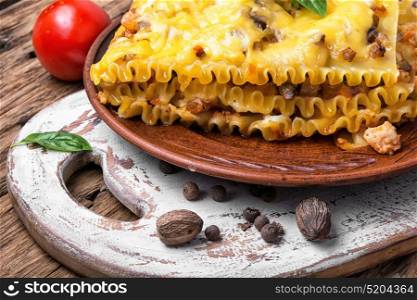 italian traditional lasagna. Traditional Classic italian lasagna on wooden rustic background