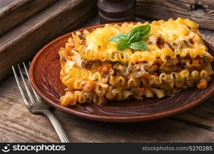 italian traditional lasagna. Traditional italian lasagna on wooden rustic background