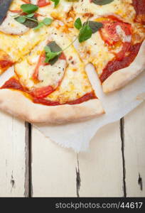 Italian traditional pizza Margherita tomato mozzarella and basil