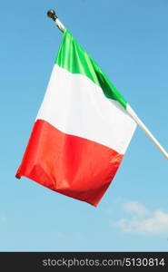 italian waving flag in the free sky concept of national symbol