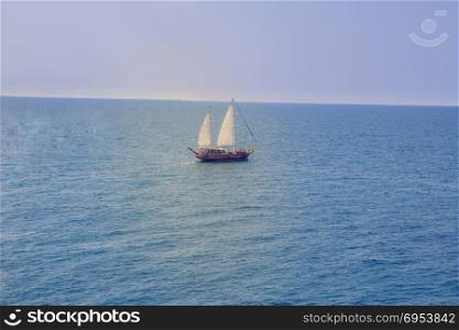 Italian wooden sailing boat sailing in the Mediterranean Sea.