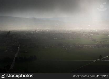 Italy, Assisi aerial view in sunlight