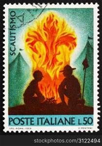 ITALY - CIRCA 1968: a stamp printed in the Italy shows Scouts at Campfire, circa 1968