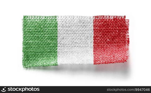 Italy flag on a piece of cloth on a white background.. Italy flag on a piece of cloth on a white background