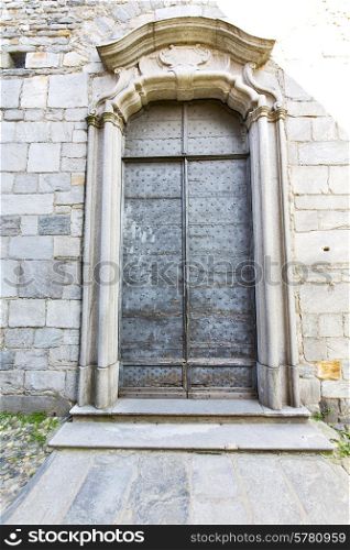 italy lombardy in the arsago seprio old church closed brick tower wall grass