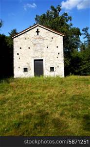 italy lombardy in the arsago seprio old church closed brick tower wall grass