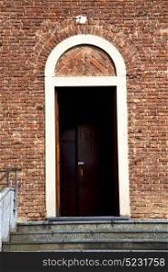 italy lombardy in the cardano al campo old church closed brick tower wall