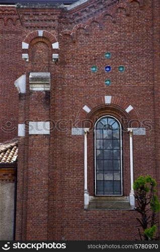 italy lombardy in the cardano campo old church closed brick tower wall rose window tile