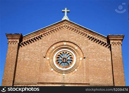 italy lombardy in the castellanza old church closed brick tower wall rose window tile