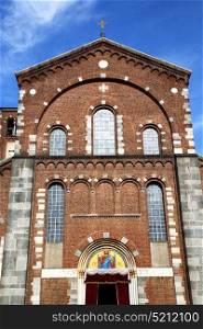 italy lombardy in the legnano old church closed brick tower wall rose window tile