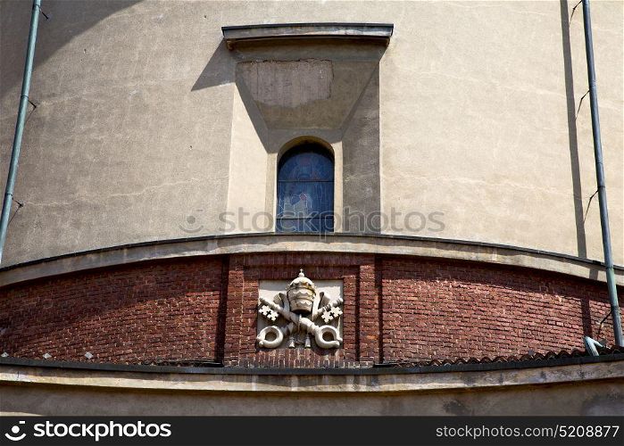 italy lombardy in the lonate ceppino old church closed brick tower wall rose window tile