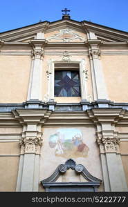 italy lombardy in the somma lombardo old church closed brick tower wall rose window tile