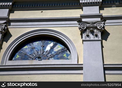 italy lombardy in the sumirago old church closed brick tower wall rose window tile