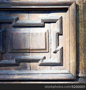 italy patch lombardy cross castellanza blur abstract rusty brass brown knocker in a door curch closed wood