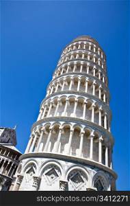 Italy - Pisa. The famous leaning tower on a perfect blue bakcground