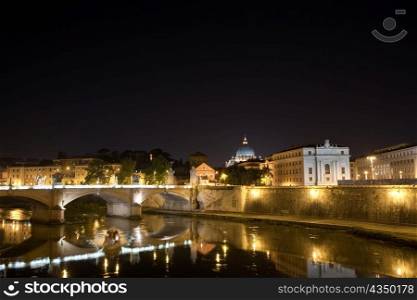 Italy. Rome. Night. The bridge Vittorio Emmanuel through Tiber.