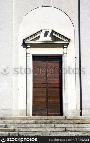 italy sumirago church varese the old door entrance and mosaic sunny daY
