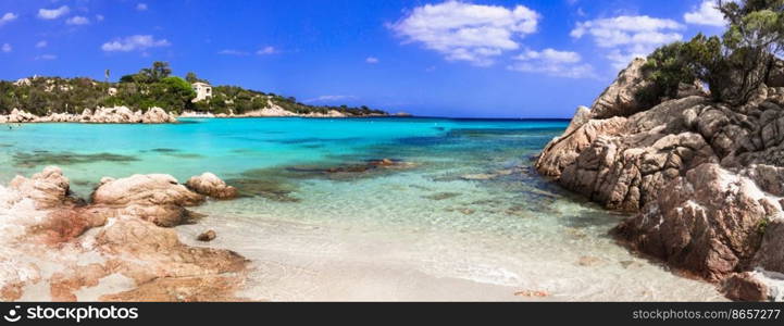 Italy summer holidyas . Sardegna island - stunning Emerald coast (Costa Smeralda) with  beautiful beaches.  popular Capriccioli beach with red rocks and  turquoise sea