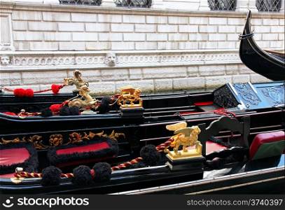 Italy. Venice. Details of typical venitian gondolas. The winged lion and golden horse on a venetian gondola.