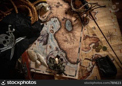 Items from pirated goods randomly laid out on the old ship's table. Pirate still life