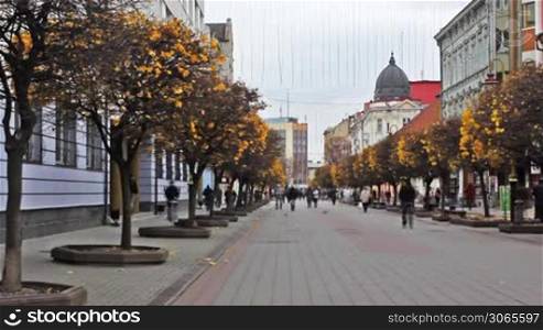 IVANO-FRANKIVSK, UKRAINE - NOVEMBER 11: People on beautiful pedestrian street of city on Nov 11, 2011 in Ukraine, Ivano-Frankivsk, time-lapse. City was founded in 1662 by Polish magnate Andrei Potocki