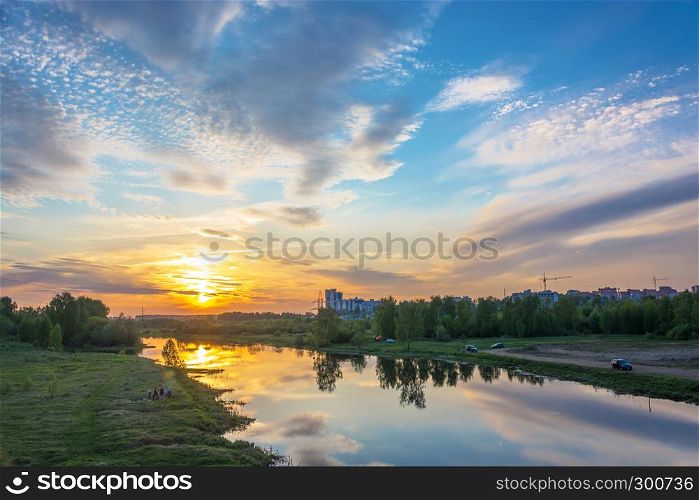 Ivanovo city, Ivanovo region, Russia-16.05.2018: Beautiful orange sunset on the Uvod river 16.05.2018 in Ivanovo city, Ivanovo region, Russia.