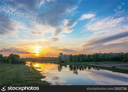Ivanovo city, Ivanovo region, Russia-16.05.2018: Beautiful orange sunset on the Uvod river 16.05.2018 in Ivanovo city, Ivanovo region, Russia.