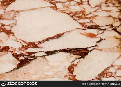 Ivory brown pieces marble tile texture background with cracks