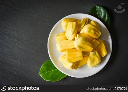jackfruit on white plate on dark background, ripe jackfruit peeled tropical fruit fresh from jackfruit tree