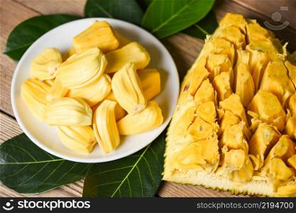 jackfruit on white plate with leaf on wooden background, ripe jackfruit peeled tropical fruit fresh from jackfruit tree
