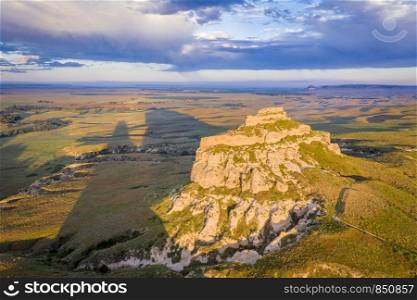 Jail Rock on Nebraska Panhandle - aerial view at summer sunrise with a long shadow