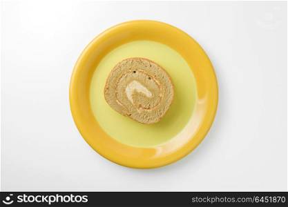 jam roll on plate isolated on white