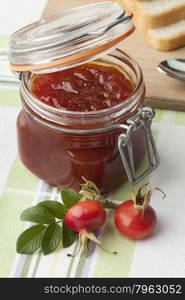 Jam with rose hips in a jar