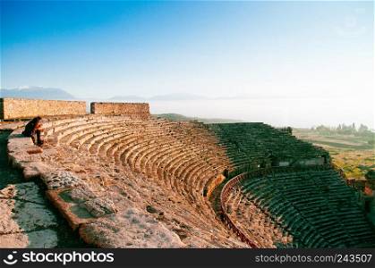 JAN 1, 2018 Pamukkale, Denizli, Turkey : Ruins of ancient Hierapolis Amphi theatre with tourist Pamukkale, Denizili, Turkey