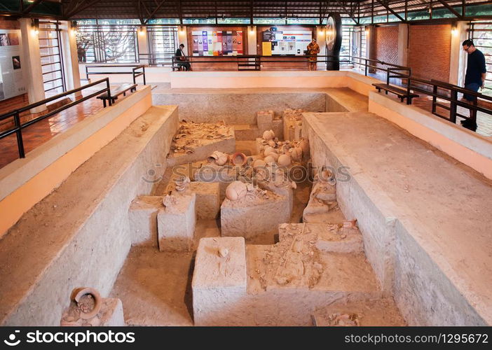 JAN 12, 2019 Udon Thani, Thailand - Ancient pottery containers and prehistory ceramic ware in excavation site of Ban Chiang Museum