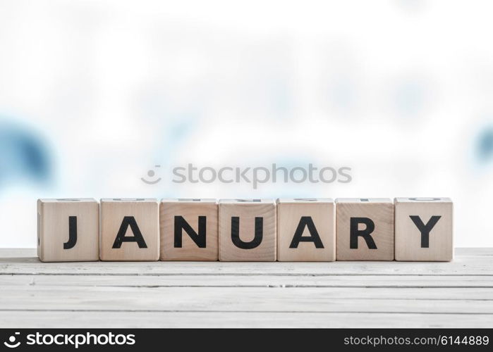 January sign on wooden cubes in cold colors