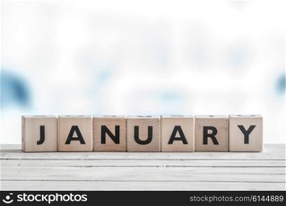 January sign on wooden cubes in cold colors