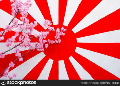 Japan flag on the old wooden background with synthesis sakura flower